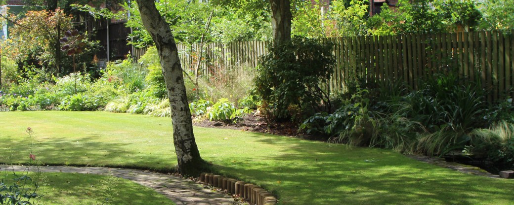 Make your garden look wider by making sure the centre of the garden is clear, sweeping the borders to the side and using circular or oval shapes